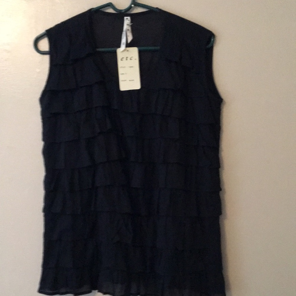 ETC.Women’s black cotton sleeveless ruffle blouse.